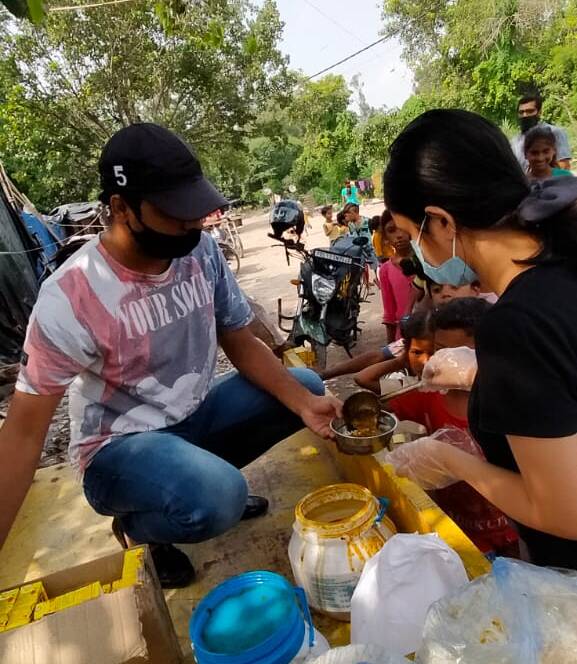 Volunteers distributing essentials