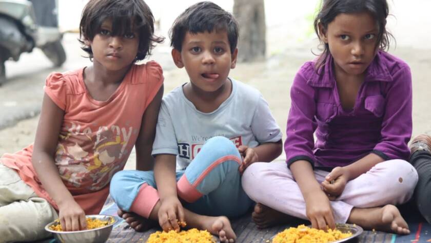 Children at a Feeding Universe food distribution drive
