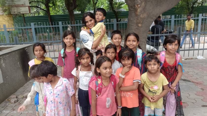 Feeding Universe volunteers celebrating with children